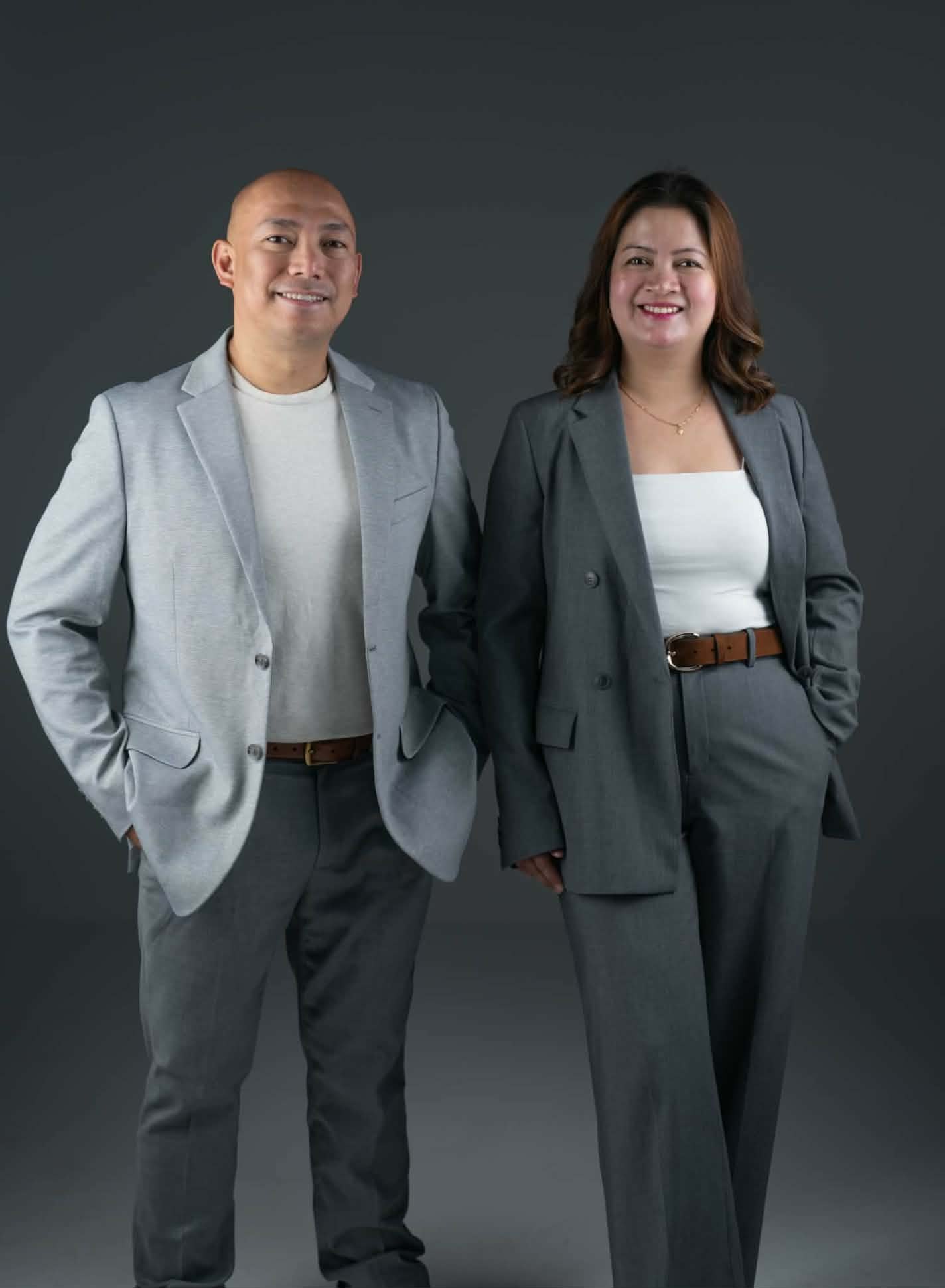 Jover Loberial, BSN, RN and Charmaine Loberial, BSN, RN standing side by side, smiling